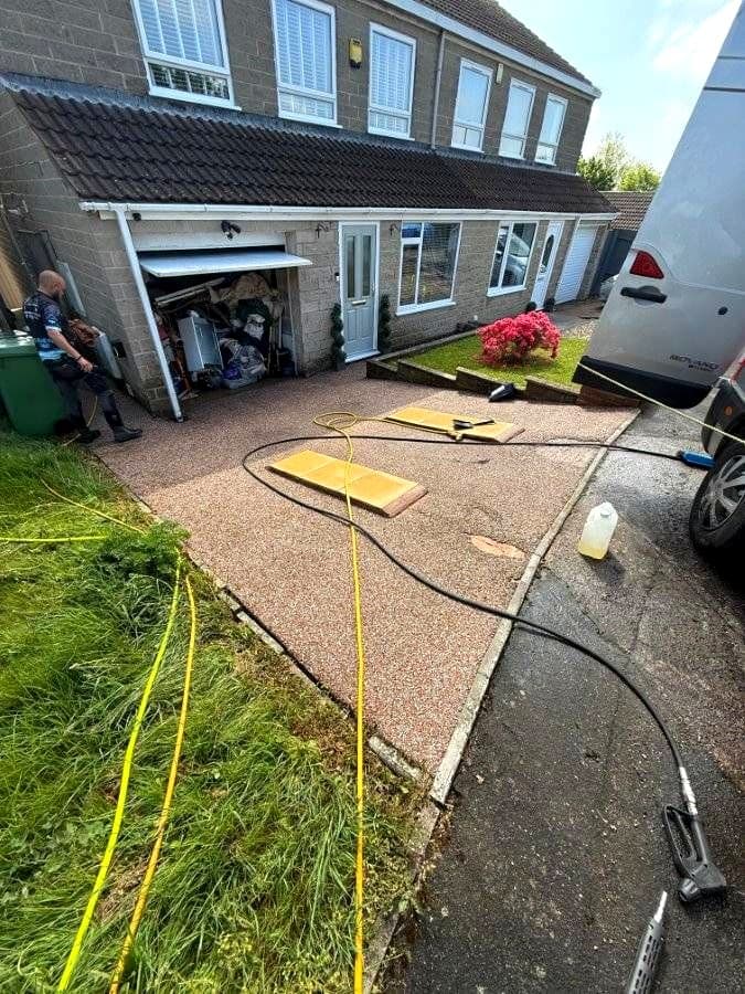 Driveway being pressure washed at a Devon home by Moor Cleaning Services